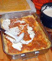 Image: Lasagne - adding the cheese bechamel sauce