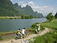 Tourists Cycling Along The River Li in Guilin