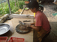 Image: Au San's wife preparing a live fish 01 - Click to Enlarge
